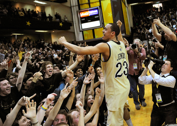 John Jenkins #23 of the Vanderbilt Commodores celebrates with fans after a win over the Kentucky Wildcats.