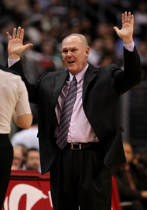 Head coach George Karl of the Denver Nuggets complains to an official duirng the game with the Los Angeles Clippers at Staples Center on March 5, 2011. in Los Angeles, California.  