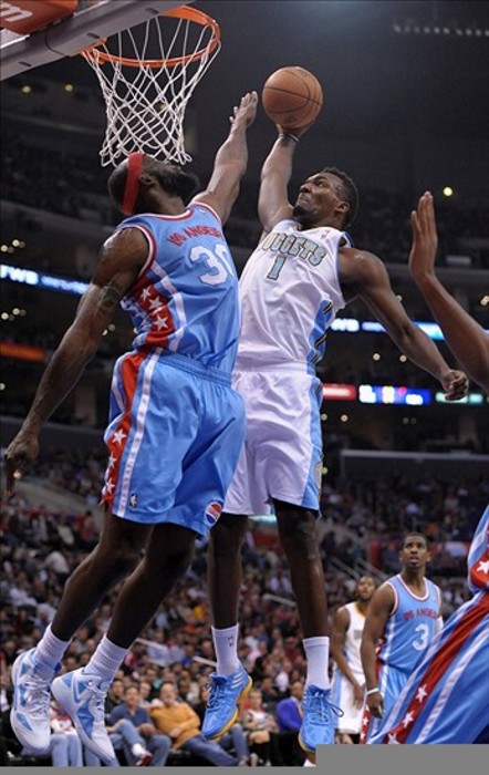 Jordan Hamilton (1) about to dunk on Reggie Evans (30) for two of his 18 points on Feb. 22, 2012 in Los Angeles.