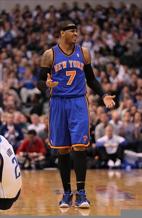 Mar 6, 2012; Dallas, TX, USA; New York Knicks forward Carmelo Anthony (7) reacts to a charging foul call on him during the game against the Dallas Mavericks at American Airlines Center.  Mandatory Credit: Matthew Emmons-US PRESSWIRE