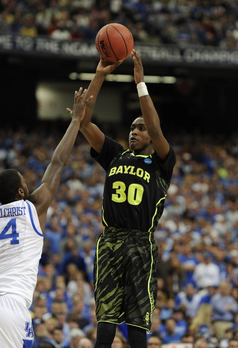 Quincy Miller (30) shoots over surefire lottery pick Michael Kidd-Gilchrist (14) in the first half during the finals of the south region of the 2012 NCAA tournament.