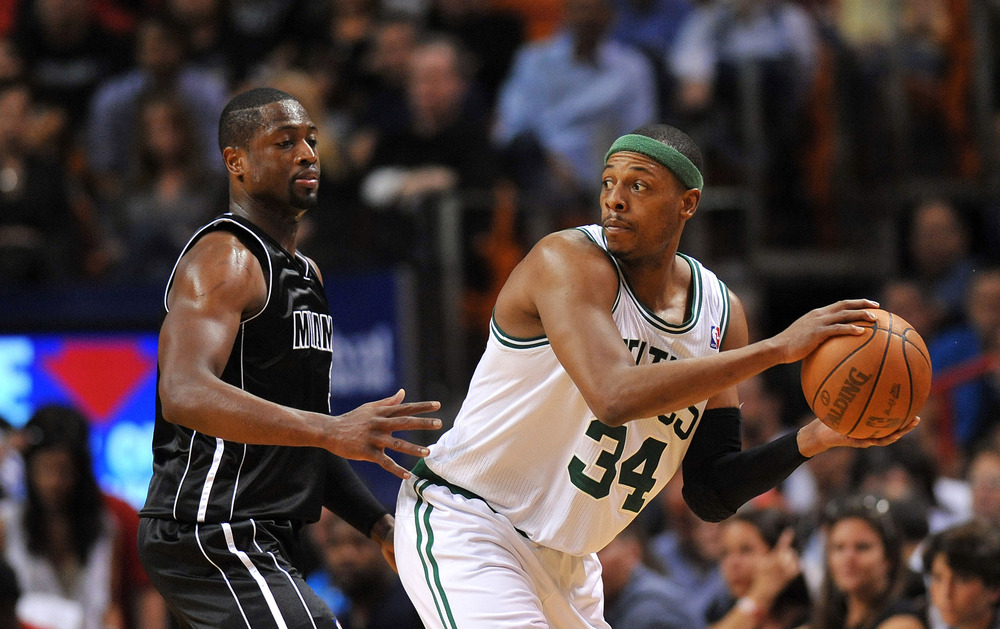 April 10, 2012; Miami, FL, USA; Boston Celtics small forward Paul Pierce (34) is pressured by Miami Heat shooting guard Dwyane Wade (3) during the second half at American Airlines Arena. Mandatory Credit: Steve Mitchell-US PRESSWIRE