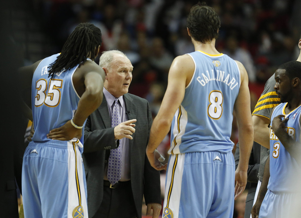 George Karl talks to small forward Danilo Gallinari (8) and forward Kenneth Faried (35) against the Houston Rockets during the second quarter at the Toyota Center. Mandatory Credit: Thomas Campbell-US PRESSWIRE