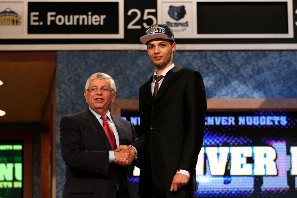 Evan Fournier greets NBA Commissioner David Stern.