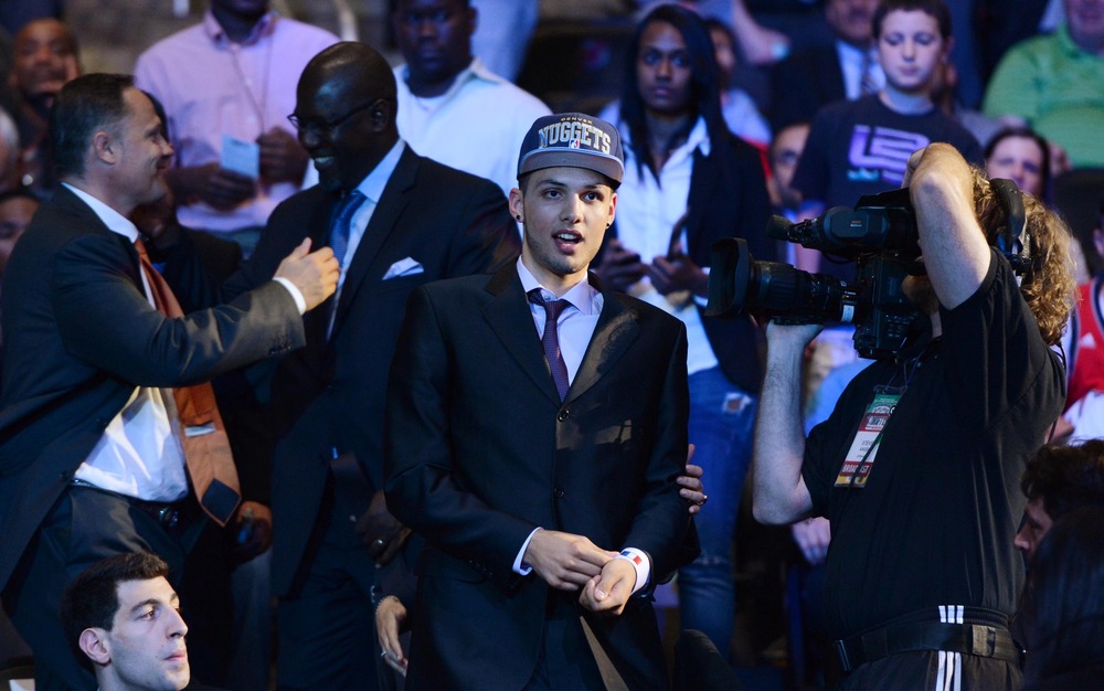 June 28, 2012; Newark, NJ, USA; Evan Fournier walks to the stage after being introduced as the number twenty overall pick to the Denver Nuggets during the 2012 NBA Draft at the Prudential Center.  Mandatory Credit: Jerry Lai-US PRESSWIRE