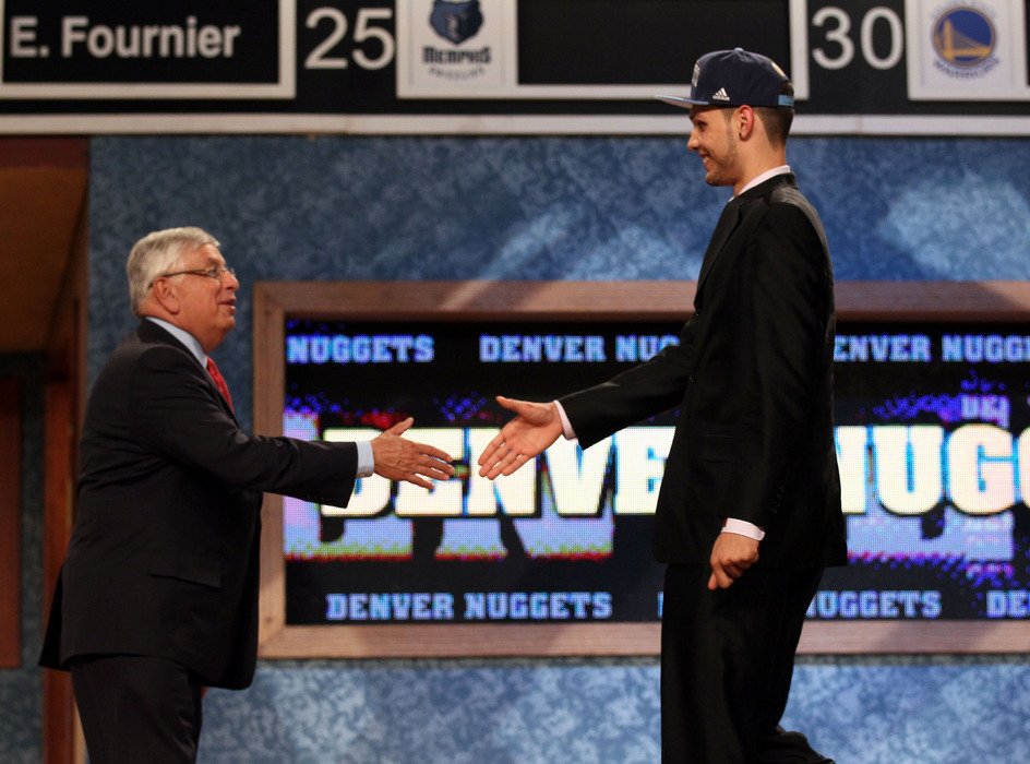 Evan Fournier from France greets NBA Commissioner David Stern after he was selected number twenty overall by the Denver Nuggets.