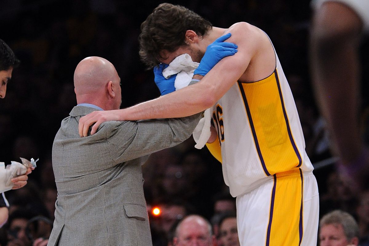 Pau Gasol getting treatment after take an accidental forearm from JaVale McGee.