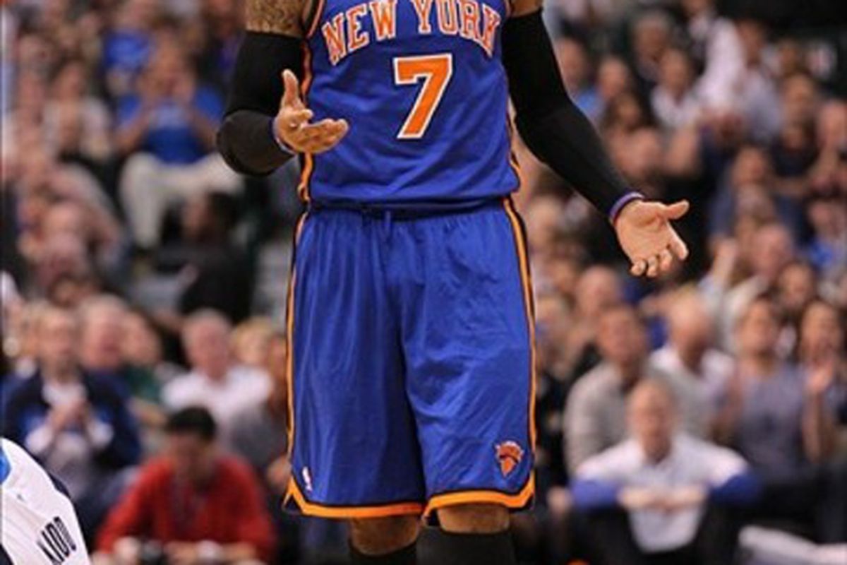 Mar 6, 2012; Dallas, TX, USA; New York Knicks forward Carmelo Anthony (7) reacts to a charging foul call on him during the game against the Dallas Mavericks at American Airlines Center.  Mandatory Credit: Matthew Emmons-US PRESSWIRE