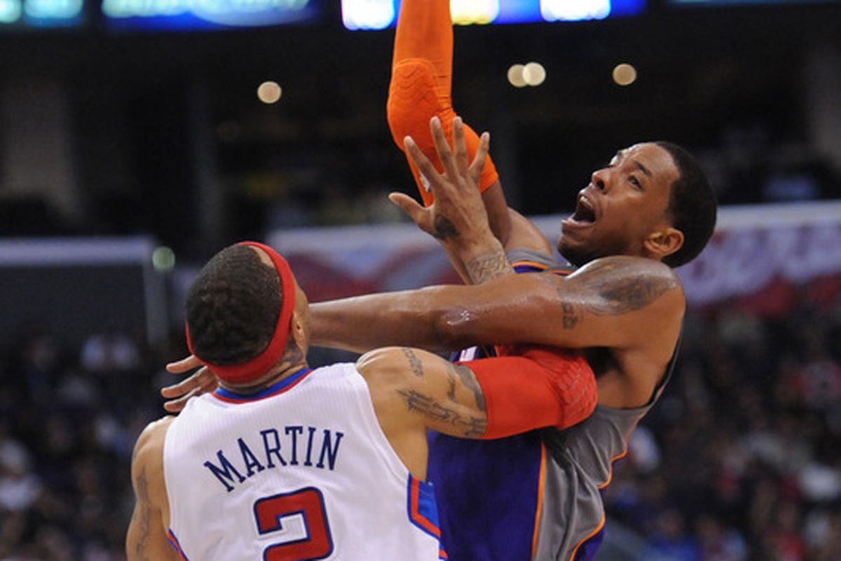 Channing Frye skies over Kenyon Martin. 