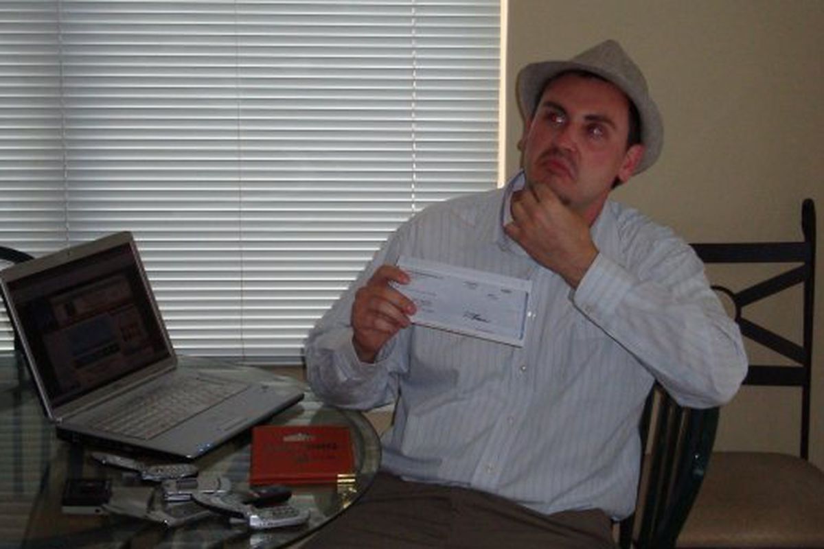 Nate Timmons in his Metro apartment with his first blogger check in 2009.