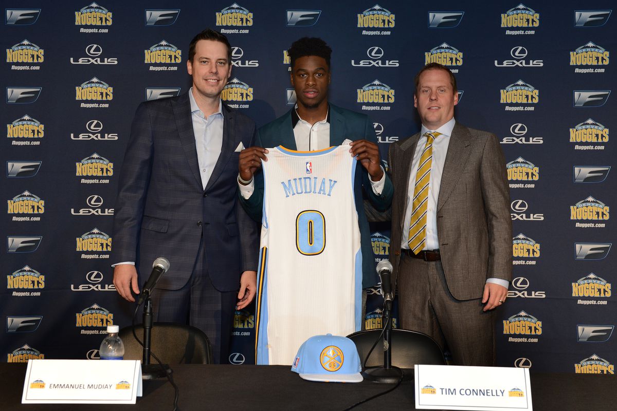 Josh Kroenke and Tim Connelly welcome Emmanuel Mudiay to Denver.