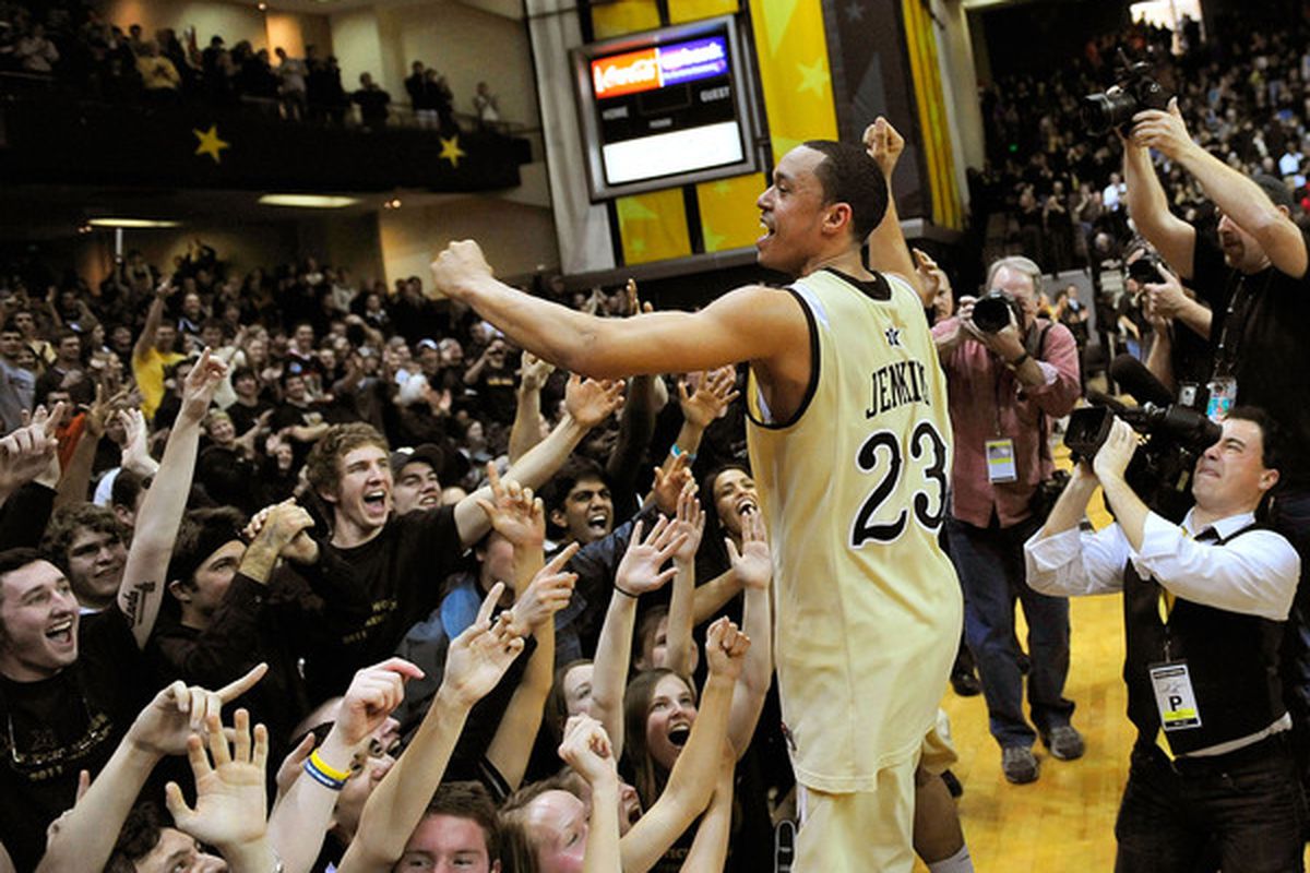 John Jenkins #23 of the Vanderbilt Commodores celebrates with fans after a win over the Kentucky Wildcats.