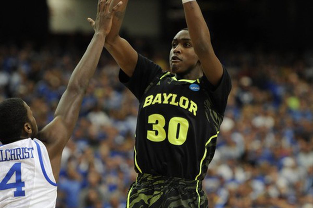 Quincy Miller (30) shoots over surefire lottery pick Michael Kidd-Gilchrist (14) in the first half during the finals of the south region of the 2012 NCAA tournament.