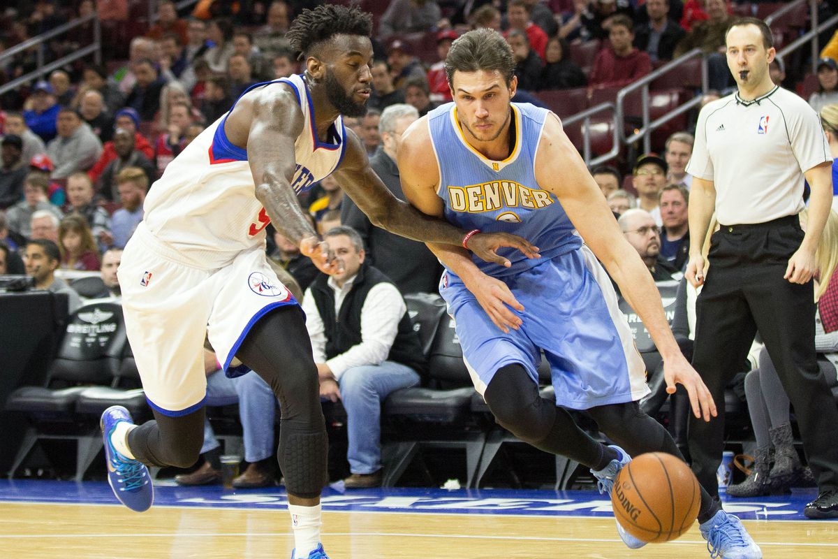 Danilo Gallinari drives past a 76er