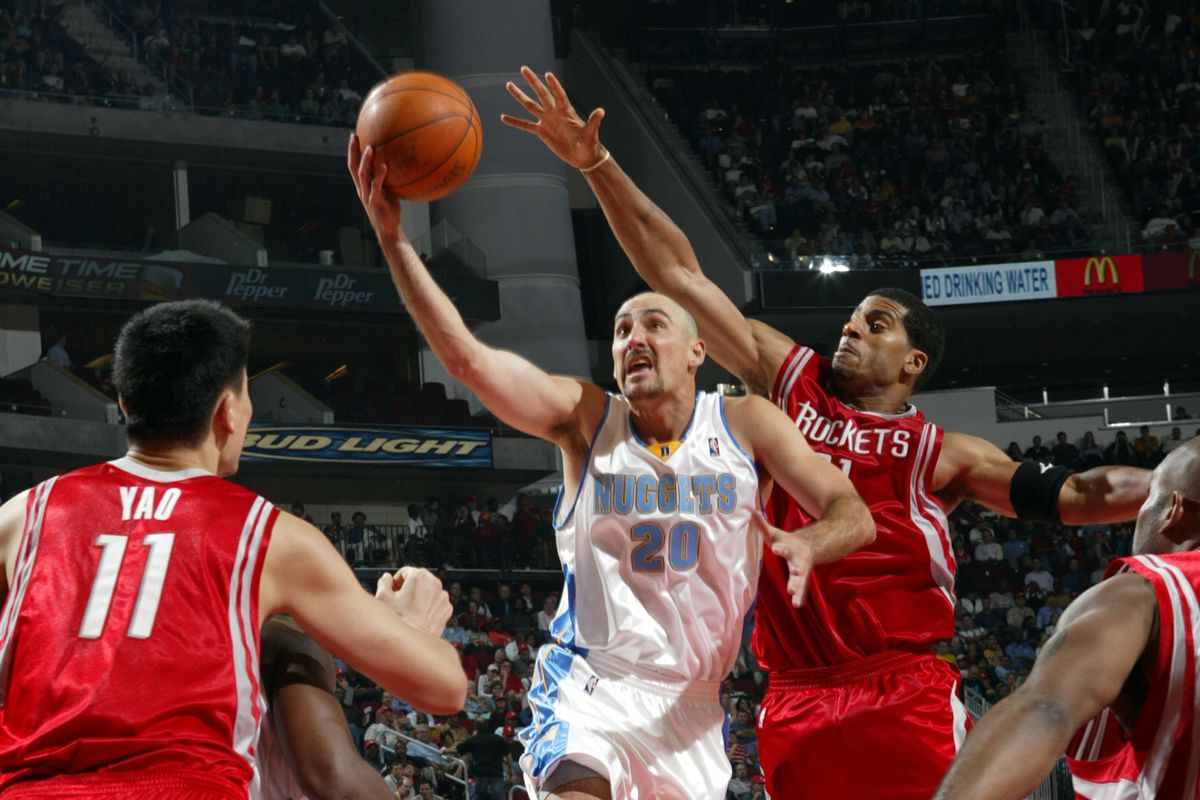Jon Barry shoots in front of Jim Jackson