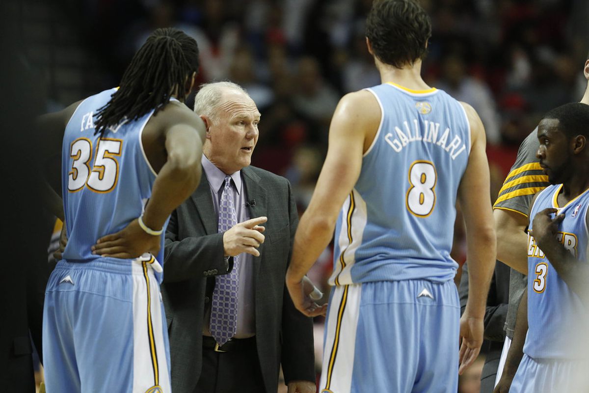 George Karl talks to small forward Danilo Gallinari (8) and forward Kenneth Faried (35) against the Houston Rockets during the second quarter at the Toyota Center. Mandatory Credit: Thomas Campbell-US PRESSWIRE