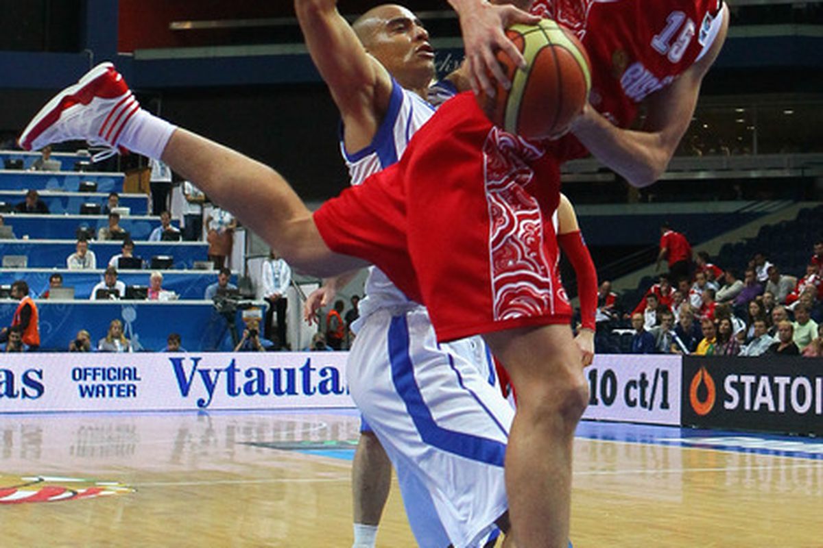 Shawn Huff of Finland defends against Andrei Kirilenko of Russia during the EuroBasket 2011 second round. 