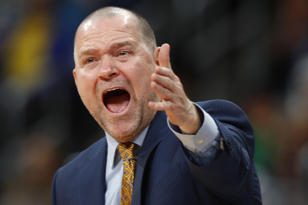 Denver Nuggets head coach Michael Malone yells at referees while facing Dallas in the second half of an NBA basketball game Monday, Dec. 19, 2016, in Denver. The Nuggets won 117-107. (AP Photo/David Zalubowski)