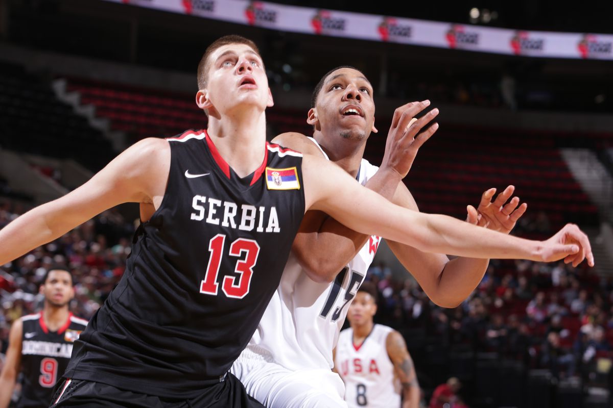 Nikola Jokic with Serbia battling Jahlil Okafor of Team USA.