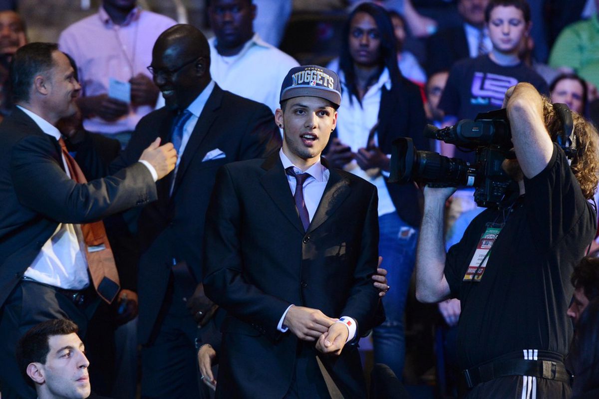 June 28, 2012; Newark, NJ, USA; Evan Fournier walks to the stage after being introduced as the number twenty overall pick to the Denver Nuggets during the 2012 NBA Draft at the Prudential Center.  Mandatory Credit: Jerry Lai-US PRESSWIRE
