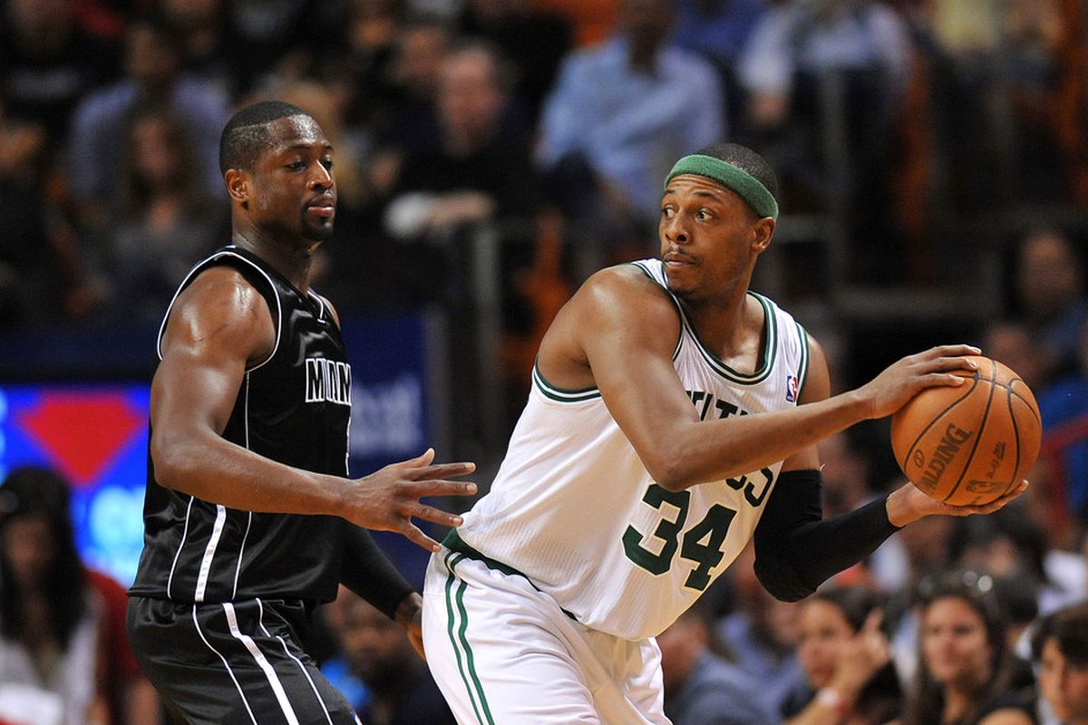 April 10, 2012; Miami, FL, USA; Boston Celtics small forward Paul Pierce (34) is pressured by Miami Heat shooting guard Dwyane Wade (3) during the second half at American Airlines Arena. Mandatory Credit: Steve Mitchell-US PRESSWIRE